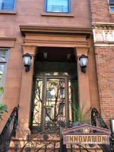Detailed shot of ornate brownstone stoop railing in Manhattan