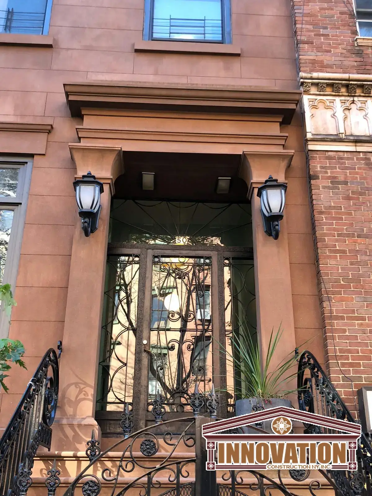 Front view of a historic East Village brownstone with restored facade