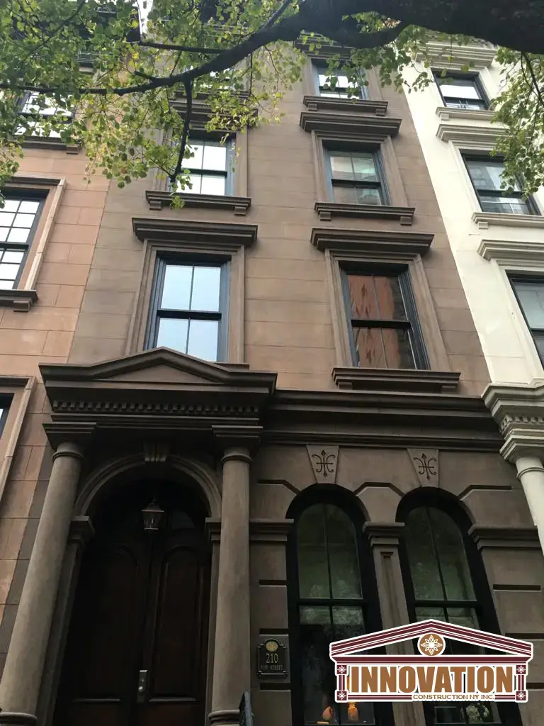 Detailed masonry work during Manhattan brownstone restoration