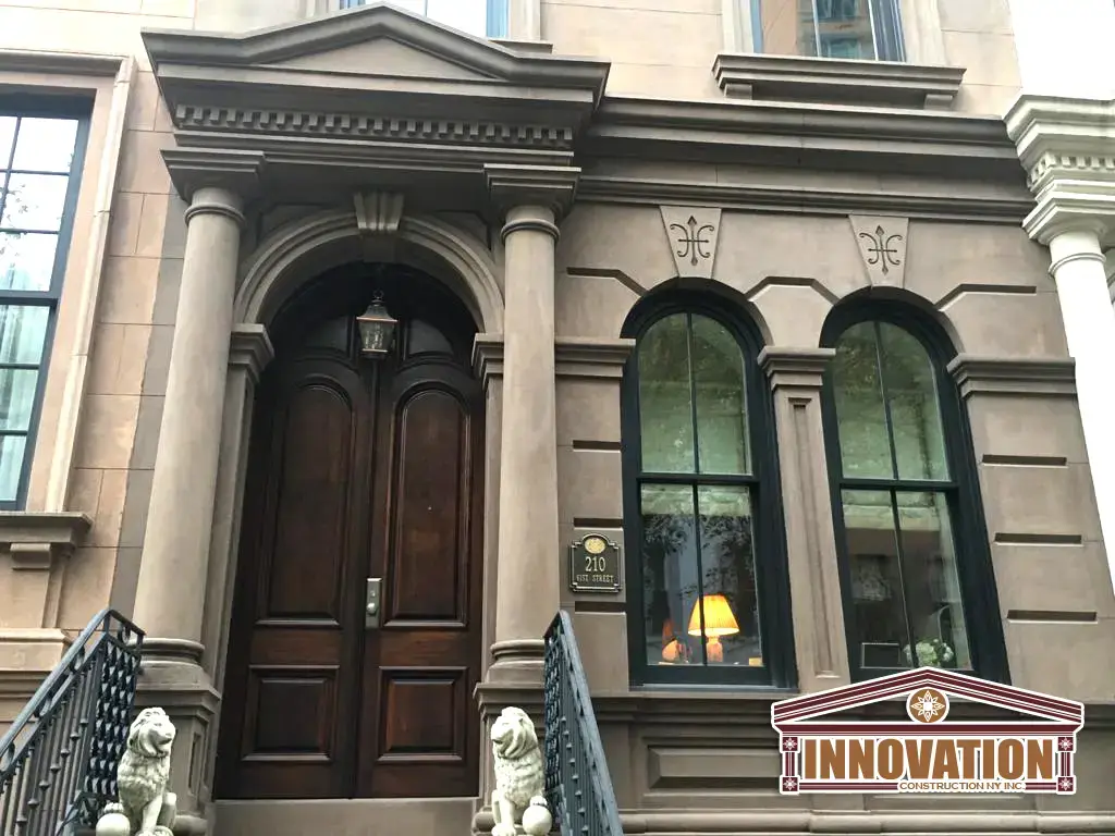 Expert craftsmen performing brownstone restoration in Manhattan