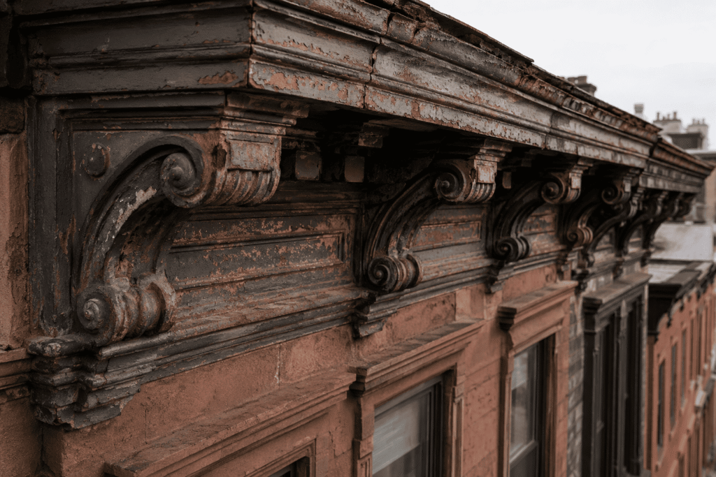 Cornice Repair NYC on a historic Brooklyn brownstone with damaged sheet metal cornice
